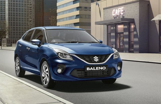 Maruti Suzuki Baleno与一个聪明的混合徽章进行了间谍